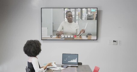 Poster - African american businesswoman on video call with african american female colleague on screen