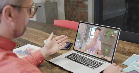 Poster - Caucasian businessman on laptop video call with caucasian male colleague on screen