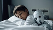 © ADDICTIVE STOCK - Generative AI illustration of cute little medical robot hugging sick boy lying on couch in hospital room technology in medicine concept