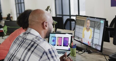 Wall Mural - African american business people on video call with african american male colleague on screen