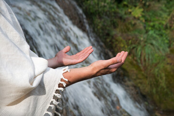 Wall Mural - Man praying at the river