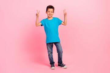 Canvas Print - Full length photo of cheerful cute small boy wear blue t-shirt showing two v-signs isolated pink color background