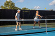 © pics721 - Female Pickleball Player Returning Ball
