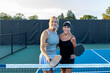 © pics721 - Two Female Pickleball Players Posing at Net