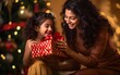 © Vladislava - Indian family photoshoot mother and daughter at Christmas. Close-up portrait of cute little girl unpacking gifts with her mom at home at xmas night new year celebration magic garlands bokeh background
