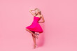Full length photo of sweet charming lady wear sexy dress dancing disco having fun isolated pink color background