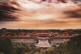 A view over forbidden city in bejing china. From the top of the hill in Jingshan park. Sunset in the sky over the old chinese city
