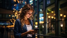 Beautiful Business Woman Using Smart Phone In The City At Night.