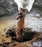 Fototapeta Natura - Jesus pulling someone from the mud