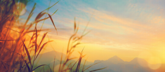 Wall Mural - Autumn sunrise cloudy sky over mountains; Abstract colorful peaceful sky background