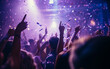 © MUS_GRAPHIC - Close up photo of many party people dancing purple lights confetti flying everywhere nightclub event hands raised up wear shiny