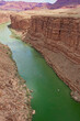 View from Navajo Bridge of a group of rafts on the Colorado River