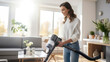 © Studio Nova - Woman housewife cleans her house with a vacuum cleaner