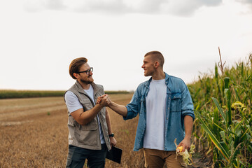 Two partners making a deal about their agricultural business.