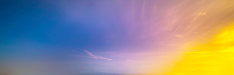 Wall Mural - blue blurry yellow light soft panorama sunset sky background with yellow clouds