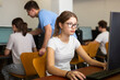 © JackF - Interested teen girl studying with classmates in school computer class