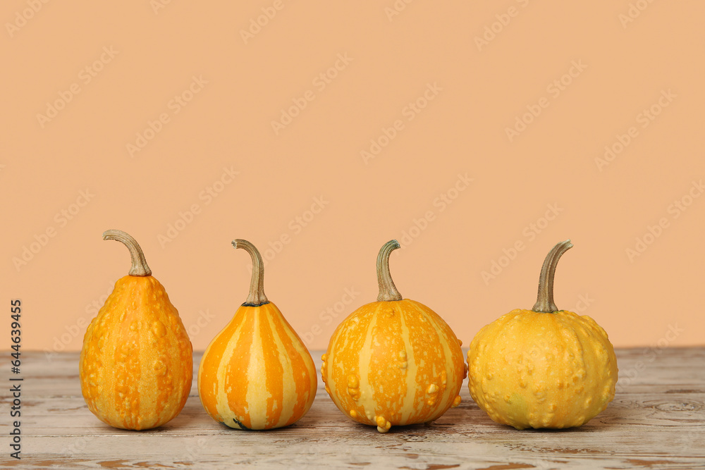 Fresh pumpkins on wooden table