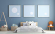 © MUS_GRAPHIC - Mock up posters in child room interior, posters on empty blue wall background