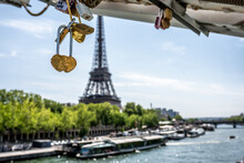 Detail Of A Love Padlock, With The Seine River And The Eiffel Tower In The Background, In Paris, France.