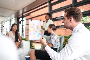 people talk and present the project. Relaxed informal business company meeting. Team leader brainstorming new approaches and ideas with colleagues. Startup business and entrepreneurship concept.