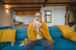 © Miljan Živković - one senior man sit on sofa bed hold Paper tissue common cold sneezing