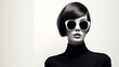 © kept - The image of a woman with glasses is a black and white photograph that creates a retro vibe reminiscent of the 1960s.