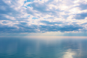 Wall Mural - a large body of water under a cloudy sky, generative ai
