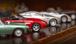 © AlenKadr - Retro car models on shelf.