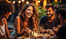 Friends And Feast: Joyful Gathering At An Outdoor Restaurant In Summer