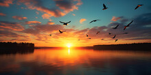 Sunset Over The Lake,,  Flock Of Geese Fly Through Breathtaking Autumn Sunrise Stock Photo
