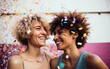 © Malchevska Studio - LGDT lesbian couple or girlfriends celebrating with confetti together