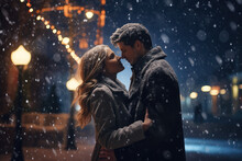 A Couple Kissing Under Christmas Lights And Snow On New Year's Eve