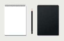 Design Concept - Top View Of A Black Stylish Spiral Notebook With A Black Colored Pencil Isolated On A Gray Background For The Layout