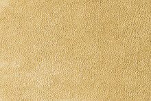 Terry Cloth, Yellow Towel Texture Background. Soft Fluffy Textile Bath Or Beach Towel Material. Top View, Close Up.