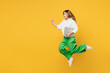 © ViDi Studio - Full body young caucasian happy fun IT woman wears white shirt casual clothes jump high hold closed laptop pc computer run fast isolated on plain yellow background studio portrait. Lifestyle concept.