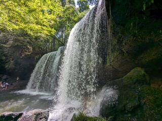 Poster - The Nabegataki Falls, where travelers can access the large cavern behind the falls