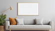 mockup cadre photo avec contour bois accroché à un mur de salon au dessus d'un canapé