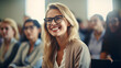 © CROCOTHERY - a smiling female student with glasses in a lecture room
