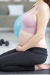 pregnant woman is doing yoga