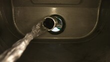 4K: Inside a fuel tank with the Nozzle filling the car up with Petrol, Gasoline or diesel. Internal view of gas pump. Clear. Stock Video Clip Footage
