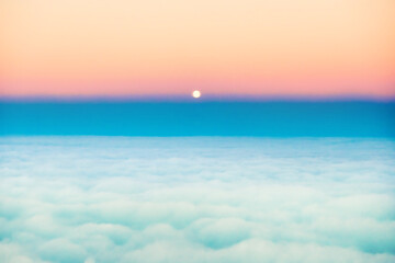Wall Mural - Sky and clouds sunset with full moon rising, aerial view from plane