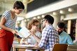 © NDABCREATIVITY - Education campus friendship people concept. Group of happy students studying together in library.