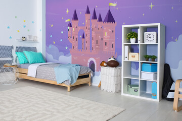 Sticker - Kid's room interior with comfortable bed. Fairytale themed wallpapers with castle