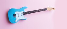 Blue Guitar Against Isolated Pastel Background Copy Space