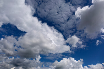 Wall Mural - Stratocumulus Clouds on Blue Sky Background.