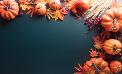 Canvas Print - Thanksgiving and Autumn decoration concept made from autumn leaves and pumpkin on dark background. Flat lay, top view with copy space.