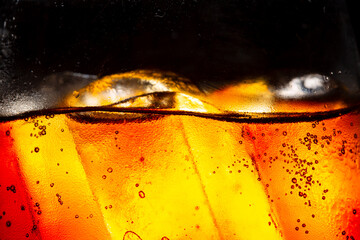 Wall Mural - Cola and Ice, food background, Cola close-up, design element. Beer. Macro bubbles, ice, bubbles, background, ice cubes, abstract background.