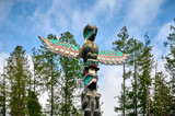 Fototapeta Góry - First Nations totem pole, carvings by Northwest Coast First Peoples. Sechelt Nation. Sunshine Coast, British Columbia, Canada. Skookumchuck Narrows Provincial Park