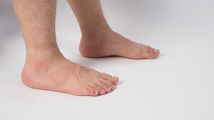 Man legs and barefoot isolated on white background. side view