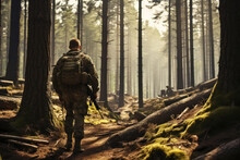 A Military Man In Uniform In A Pine Forest Walks Along The Path. Copy Space For Text